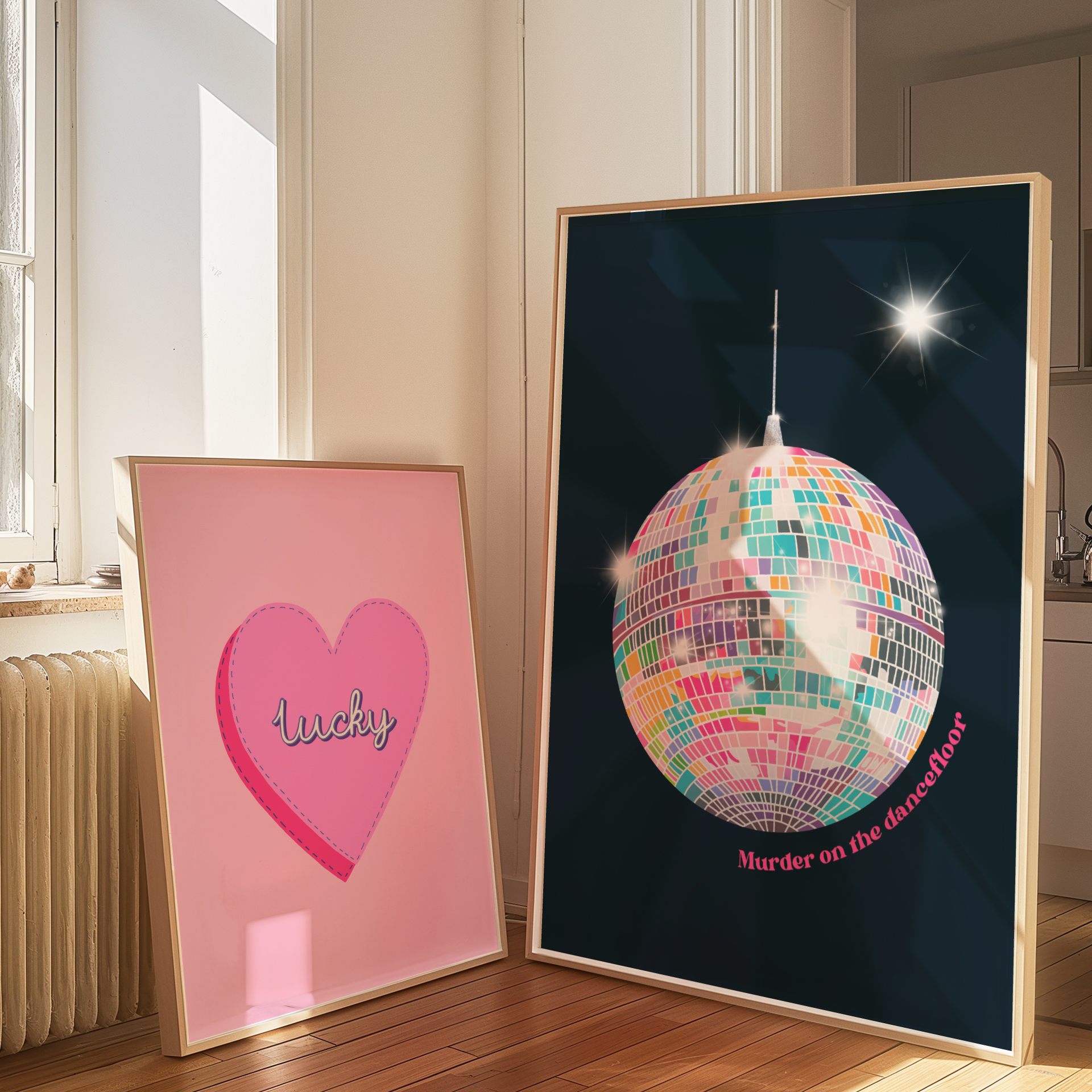 Two framed posters in a room with a pink heart-shaped frame and a disco ball design.